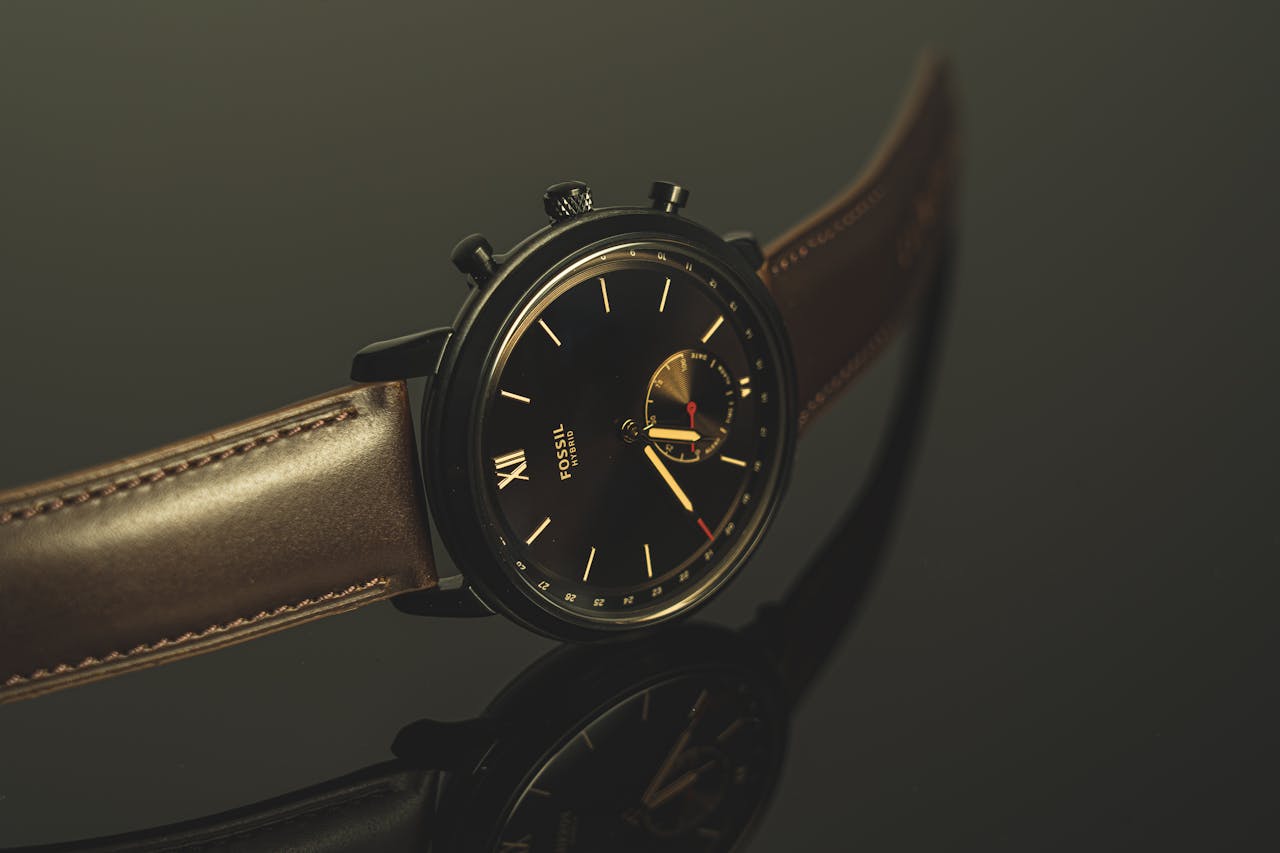 Home Luxurious black wristwatch with leather strap and analog display in close-up view.